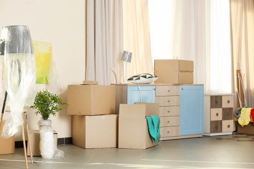 Furniture and boxes being unloaded at a new home