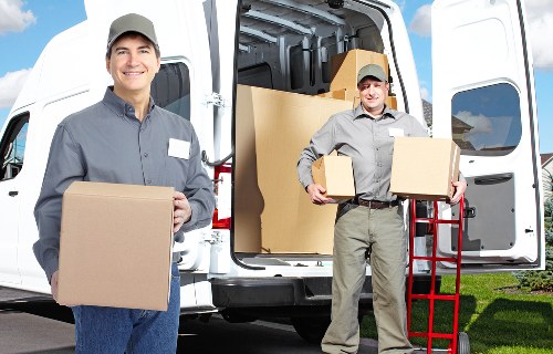 Local removals team handling furniture and boxes during a Highbury house move