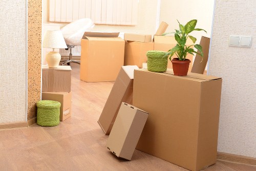 Careful loading of business furniture for relocation in Highbury