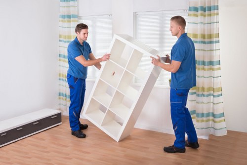Removal team loading household items for a Highbury home move