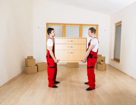 Professional office moving team handling equipment in Highbury